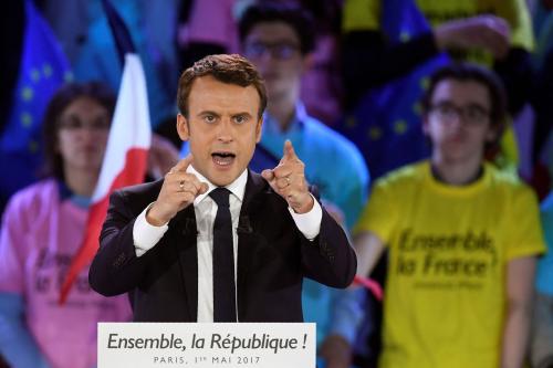 As overseas voters go to polls, can Macron march to parliame